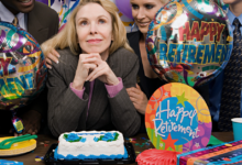 people gathered around a cake at a retirement party