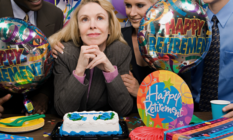 people gathered around a cake at a retirement party