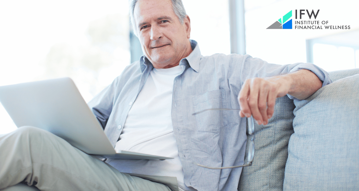 An image of a senior person in a business suit working on a laptop, representing the concept of working after retirement as discussed in the Institute of Financial Wellness' tips for success.