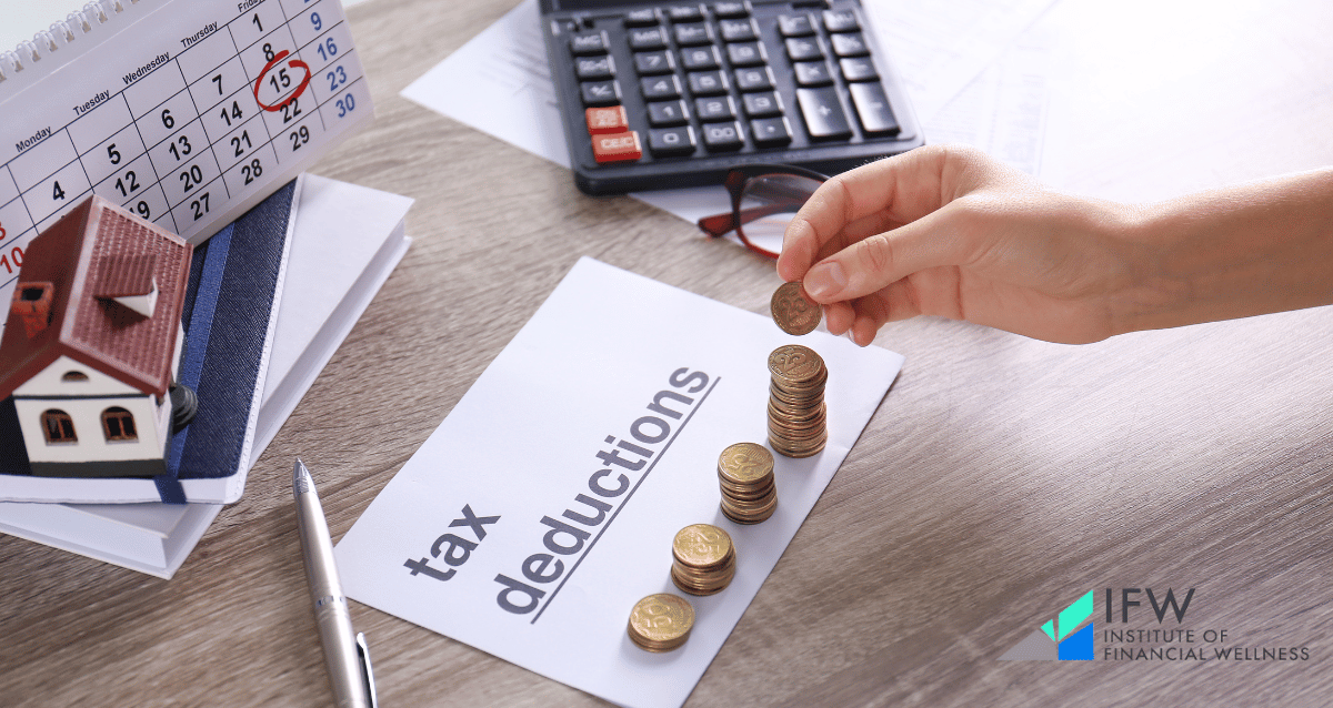 A person calculating their tax deductions through charitable donations